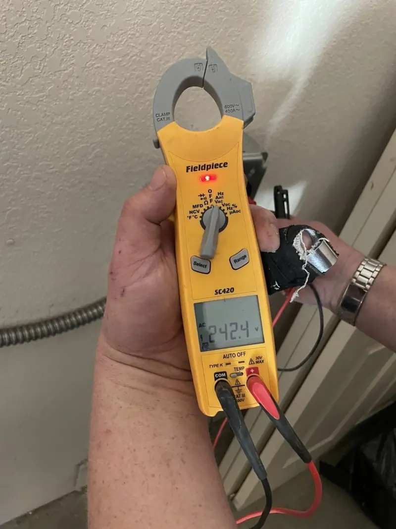 Voltage testing with clamp meter during Ceiling Fan Installation in Tarrant